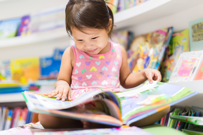 girl reading in library